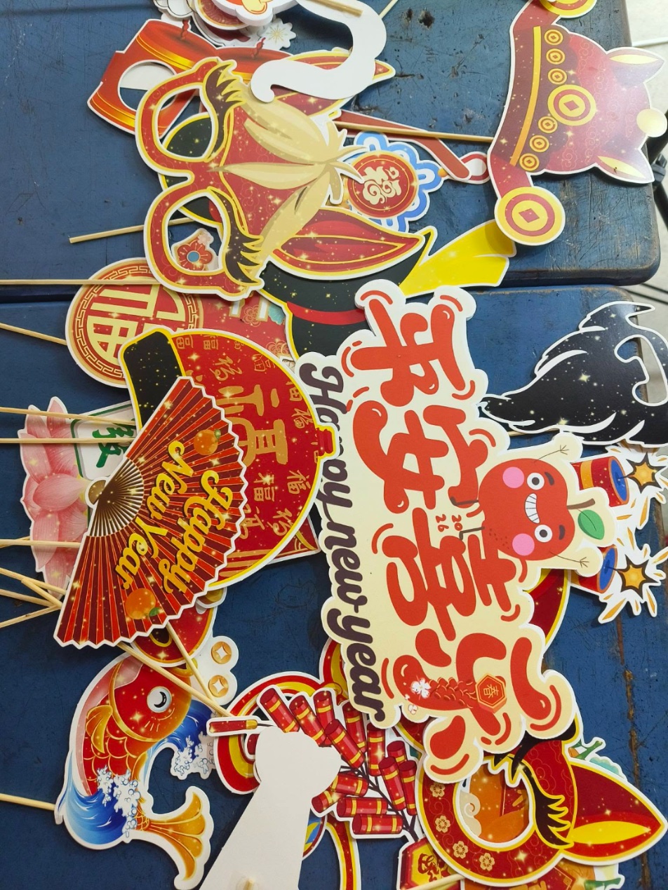 Themed photo booth props laid out before an event